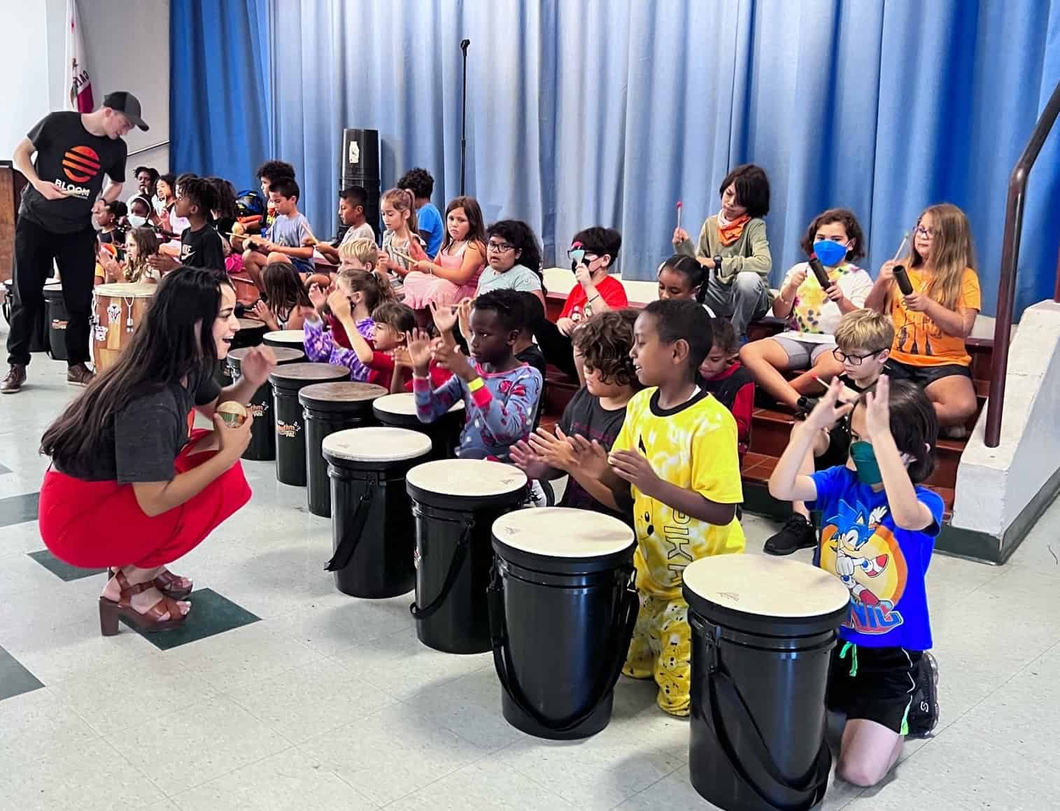 Students drumming together
